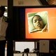 A photo of Jahi McMath is shown on a video screen next to her uncle Timothy Whisenton at a news conference in San Francisco on Dec. 23, 2015.
